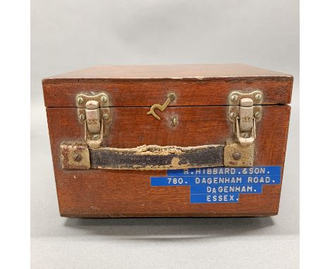 A cased pigeon racing clock.