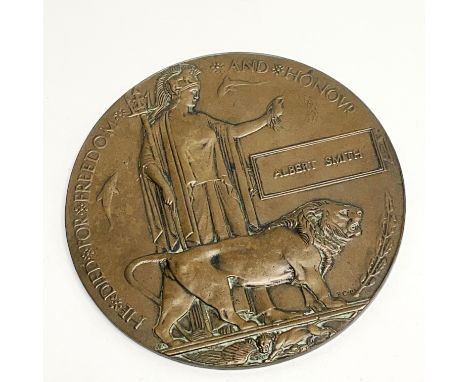 A WW1 bronze death plaque.