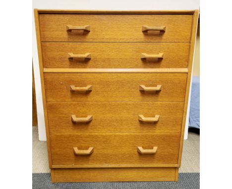 A 1960's light oak five draw chest, W. 75cm H. 98cm.
