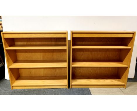 A pair of light oak bookcases, W. 91cm H. 91cm.