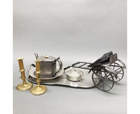 A 1920's hammered pewter tray with pewter dish, teapot and candlesticks etc. Tray W. 50cm.