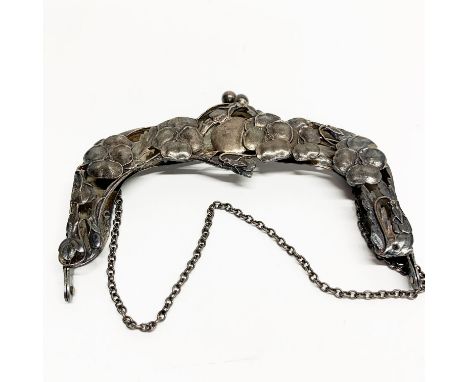 An Art Nouveau hallmarked silver handbag frame, W. 11cm.