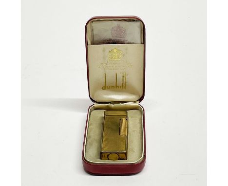 A boxed vintage Dunhill lighter.