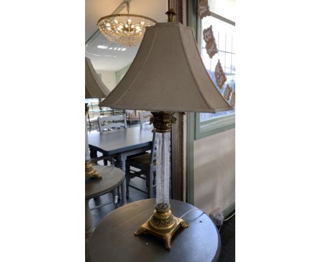 A brass and glass table lamp with ivory coloured shade 