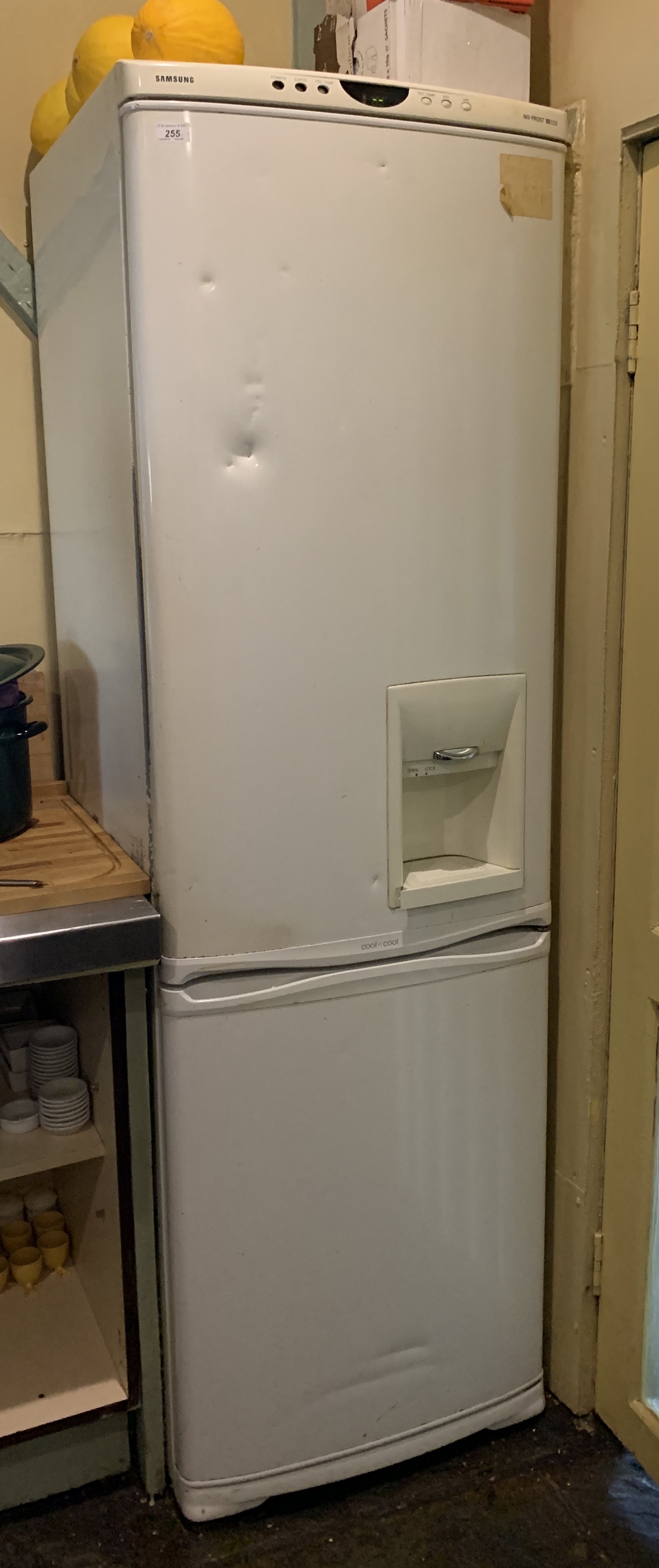 A Samsung upright fridge/freezer with ice dispenser