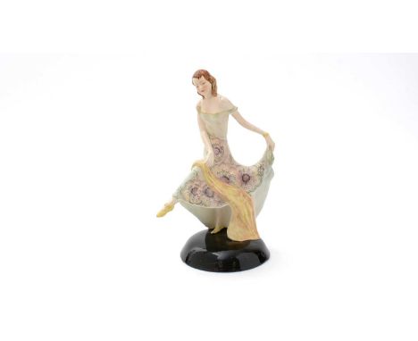 A Staffordshire Goldscheider pottery figure (1946-1959), in Art Deco style, depicting a dancing girl in floral dress, circula