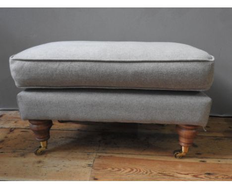 CONTEMPORARY UPOHOLSTERED FOOT STOOL ON TURNED LEGS WITH BRASS CASTORS (73cm long, 44cm wide, 42cm high)