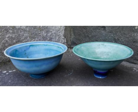 MARY RICH (b. 1940) TWO FOOTED BOWLS each covered in a rich mottled blue / green glaze, impressed marks 12.5cm &amp; 13.5cm d