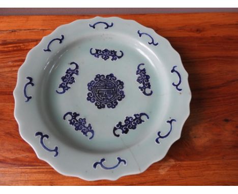 CELADON AND UNDERGLAZE BLUE 'BATS AND RUYI' DISH QING DYNASTY the barbed dish decorated with bands of stylized bats and ruyi,