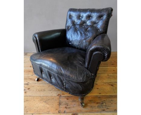 VINTAGE DISTRESSED BLACK LEATHER BUTTON BACK TUB CHAIR ON TURNED FRONT LEGS AND CASTORS (92cm wide, 88cm high, 75cm high) 