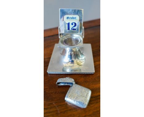 HALLMARK SILVER INKWELL AND VESTA CASE, inkwell (10.5cm square) with unusual folding calendar lid , marked Walker &amp; Hall,