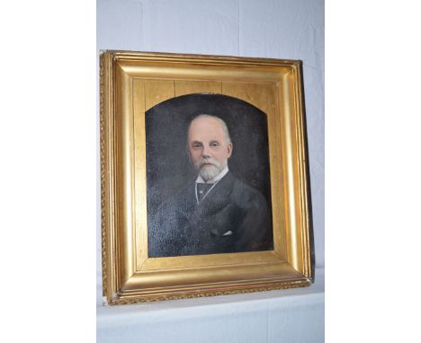 An early 20th Century over painted photograph - portrait of a bearded gentleman, singed O. Butler, in gilt frame.