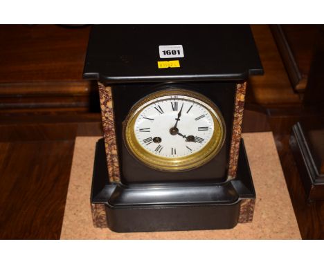 A French black marble and slate mantel clock with enamel dial.
