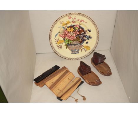 A Clarice Cliff "Ophelia" pattern plate for Newport Pottery, Burslem; a pair of early 20th Century children's clogs with leat
