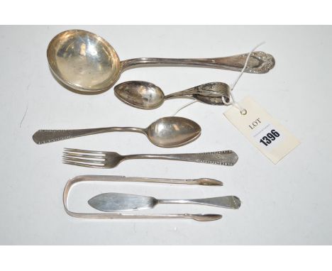 Silver, to include: a French ladle with leaf pattern and monogram finial; together with sugar tongs; baby spoon; fork; butter