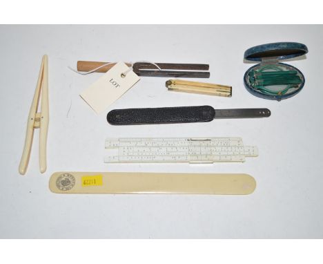 A late 19th Century brass mounted folding ivory ruler; a pair of green plastic folding glasses; a page turner; a tuning fork;