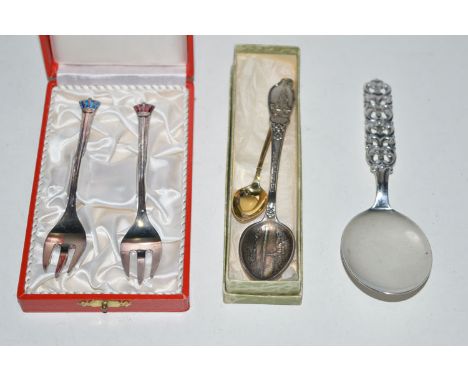 An 830 standard silver Danish cake slice with scrolling handle, by N.M.; together with a silver gilt and enamel coffee spoon,