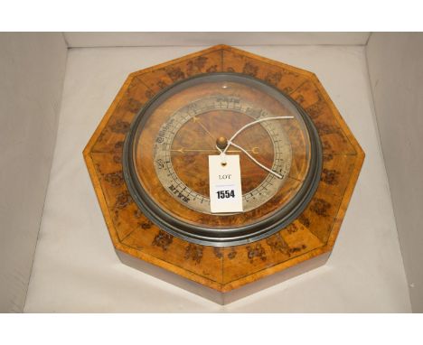 An early 20th Century octagonal shaped barometer, in burr walnut case.