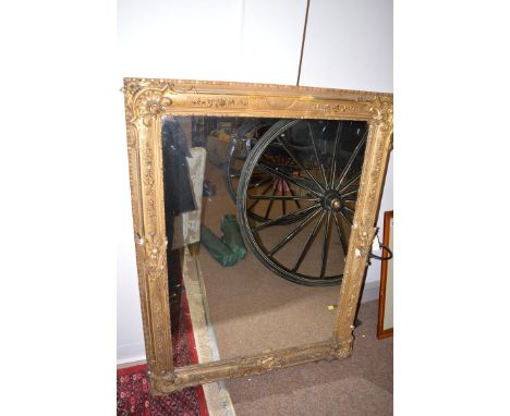 Two wall mirrors in ornate gilt frames, decorated with shells, flowers and scrolls (some losses, possibly originally picture 