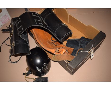 A vintage Cromwell motorcycle helmet, c.1950; goggles; leather face protector; a motorbike leather despatch satchel; and a br