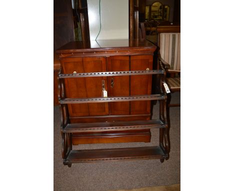 A reproduction television cabinet, 73cms wide; together with a four-tier open waterfall wall shelf by Rackstraw, 75cms wide.