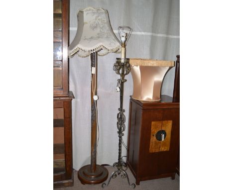 An Asian style carved stained wood standard lamp; together with a metal standard lamp.
