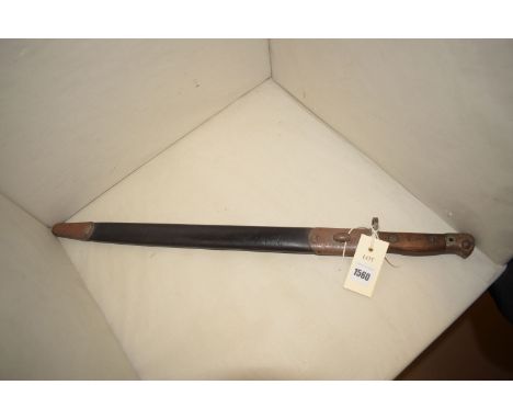 An early 20th Century bayonet by Wilkinson, dated 1907, in leather scabbard.