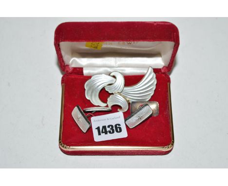 A pair of Norwegian enamel cufflinks; together with a silver gilt and white enamel scroll pattern brooch and similar earring 