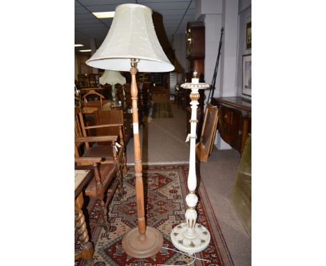 A white and gold painted standard lamp; together with a turned wood standard lamp.