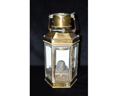 A BRASS SHIPS BULKHEAD LAMP  the swing handle with wooden grip, stamped 'BULPITT &amp; SONS LTD 1940 BIRMINGHAM' to chimney a