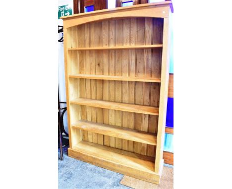 A CONTEMPORARY LIGHT OAK BOOKCASE  fitted with four fixed shelves, 127cm wide 31cm deep 172cm high Condition Report : good co
