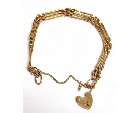 A MARKED 9CT HEART PADLOCK THREE GATE BRACELET the bracelet fitted with a safety  chain and measuring approx. 17cm in length,