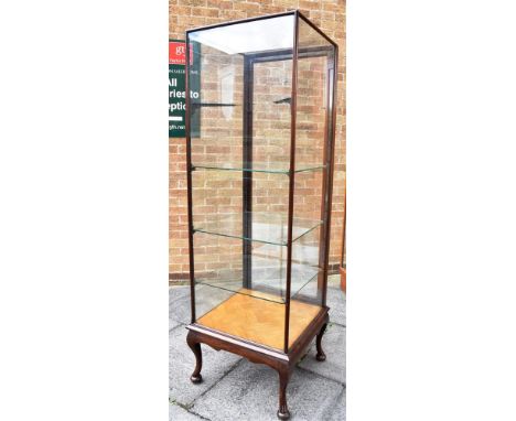 A MAHOGANY FRAMED SHOPFITTING/HABERDASHERY DISPLAY CABINET  on cabriole supports, fitted with three adjustable glass shelves,