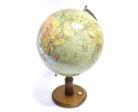 A TERRESTRIAL GLOBE  mid 20th century, printed in Germany, the base with integral compass, overall 52cm high. Condition Repor