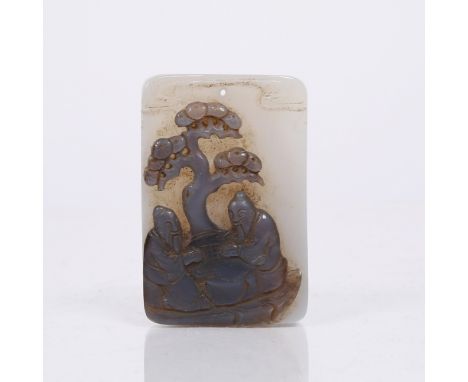 A Chinese bluish grey agate rectangular pendant 19th Century the facial side carved in dark grey stone with two seated Immort