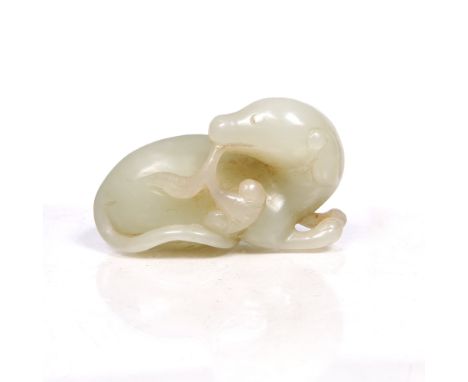 A Chinese white jade pebble 19th Century carved as a recumbent deer holding a ling chih fungus spray in its mouth, length 5cm