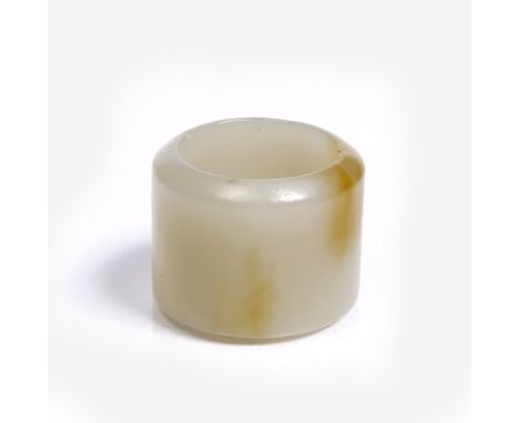 A Chinese jade archer's ring 18th/19th Century of cylindrical form, the stone of white jade with a single faint brown blush, 