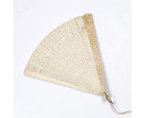 A Chinese Canton ivory fan 19th Century finely pierced and carved with a 'lace work' design of figures and pavilions in a lan