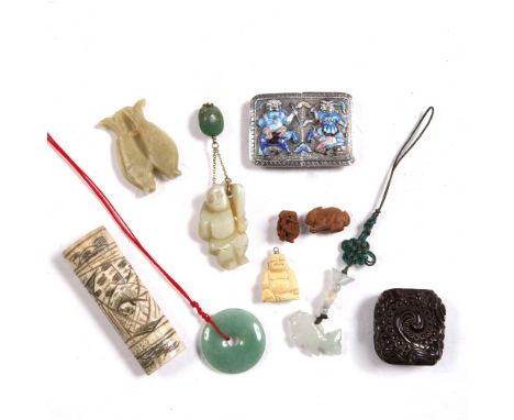 A Chinese silver and enamel buckle and a jade fish pendant, an amber ring and other pieces
