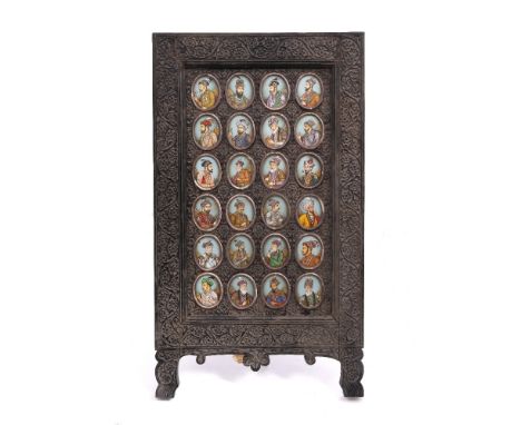 Indian School 19th Century set of twenty four oval miniature Mughal portraits, each on ivory, in a carved ebony easel frame, 