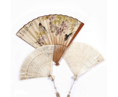 A Chinese Canton ivory fan late 19th Century carved with floral and scroll designs to emulate lace work, 22.5cm, another simi