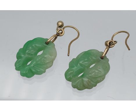 A Pair of Chinese hand carved jade and gold earrings.