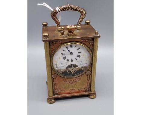 An Early 20th century French 8 Jours carriage clock. with raised relief figure panels. [8.5x5.5x4cm] 