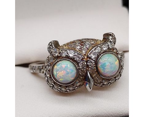 A Silver 925 owl head shaped ring. Set with opal eyes and cz stones. [Ring size S] 