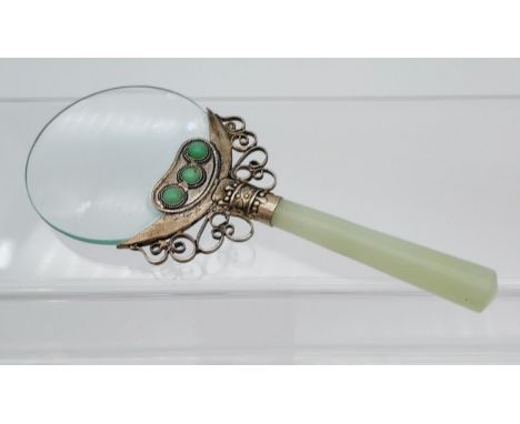 An Antique Chinese jade handle magnifying glass. Designed with a white metal neck support fitted with 6 various turquoise sty