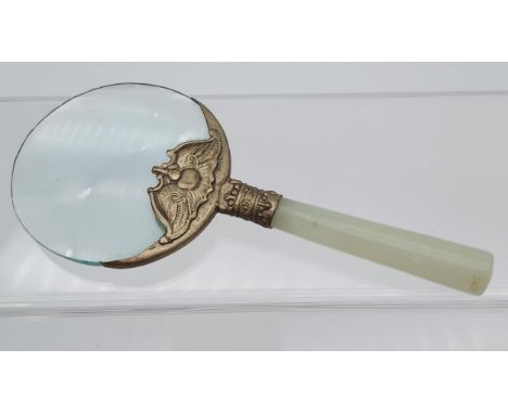 An Antique Chinese jade handle magnifying glass. Designed with a white metal neck support. [13.2cm in length]