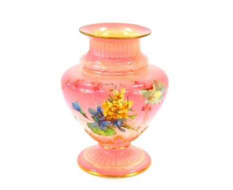 A late 19thC Royal Worcester porcelain vase, of fluted baluster form, painted with meadow flowers, against a blush pink groun