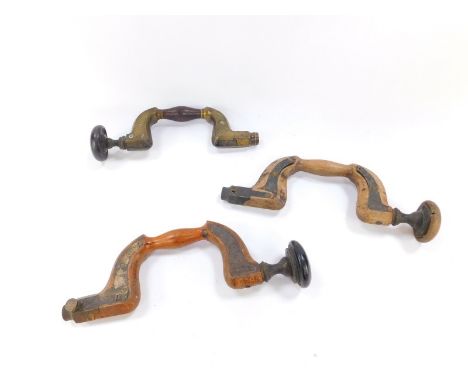Three carpenter's button pad drill braces, one 19thC in brass and rosewood, signed W Kent, Sheffield, and two beech braces wi