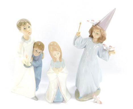 A Lladro porcelain figure modelled as Magical Moment, 06171, boxed, together with a Lladro figure group of a boy and girl in 
