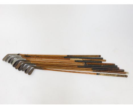 Ten vintage golf clubs, all irons with wooden shafts, to include one for Lilywhites Ltd of London., and one by Harris of Mont